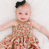 The Smocked Onesie in Poppy Floral