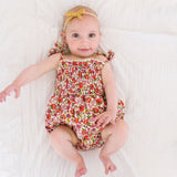 The Smocked Onesie in Poppy Floral