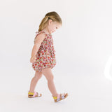 The Smocked Onesie in Poppy Floral