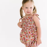 The Smocked Onesie in Poppy Floral