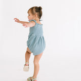 The Smocked Onesie in Aegean Blue