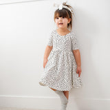 The Short Sleeve Ballet Dress in Ivory Dot