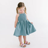 THE BABY SMOCKED DRESS IN AEGEAN BLUE