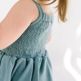 THE BABY SMOCKED DRESS IN AEGEAN BLUE