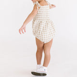 THE SMOCKED ONESIE IN KHAKI GINGHAM