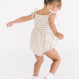 THE SMOCKED ONESIE IN KHAKI GINGHAM