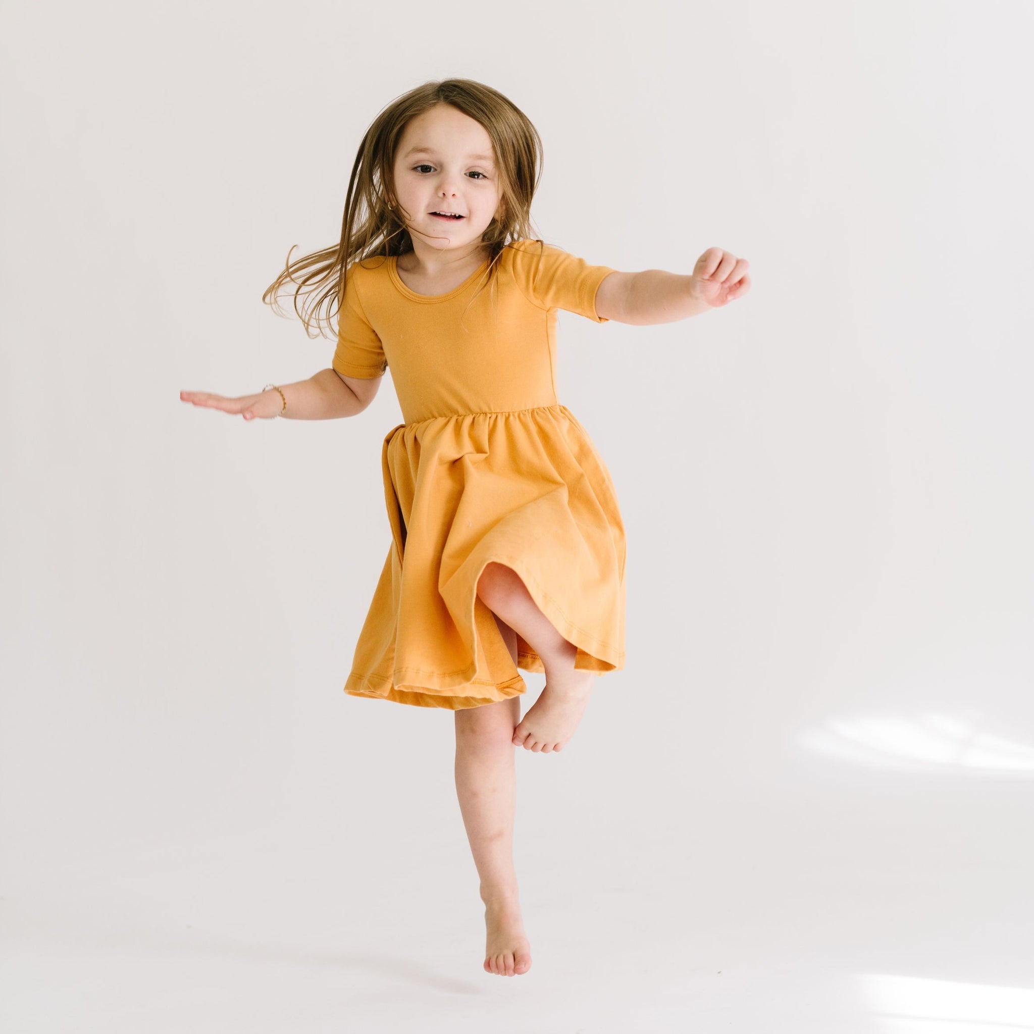 THE SHORT SLEEVE BALLET DRESS IN HONEY