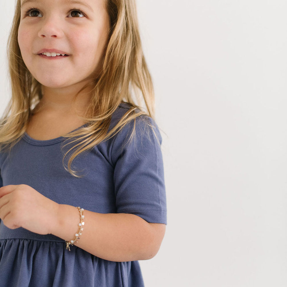 THE SHORT SLEEVE BALLET DRESS IN BLUE SEA