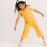 THE SHORT SLEEVE WIDE LEG JUMPSUIT IN ZINGY PETALS