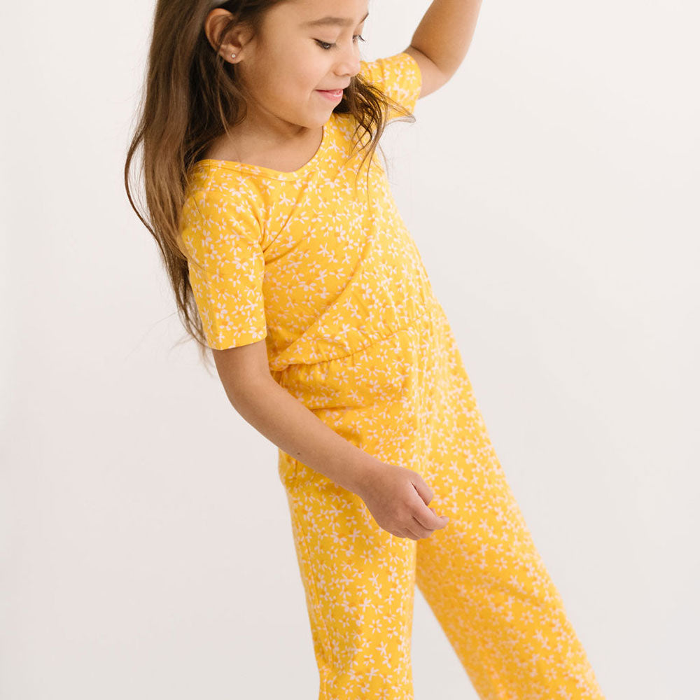 THE SHORT SLEEVE WIDE LEG JUMPSUIT IN ZINGY PETALS