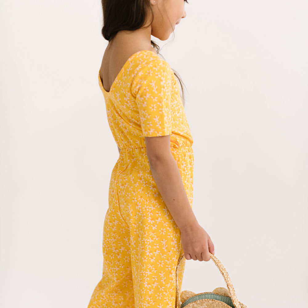 THE SHORT SLEEVE WIDE LEG JUMPSUIT IN ZINGY PETALS